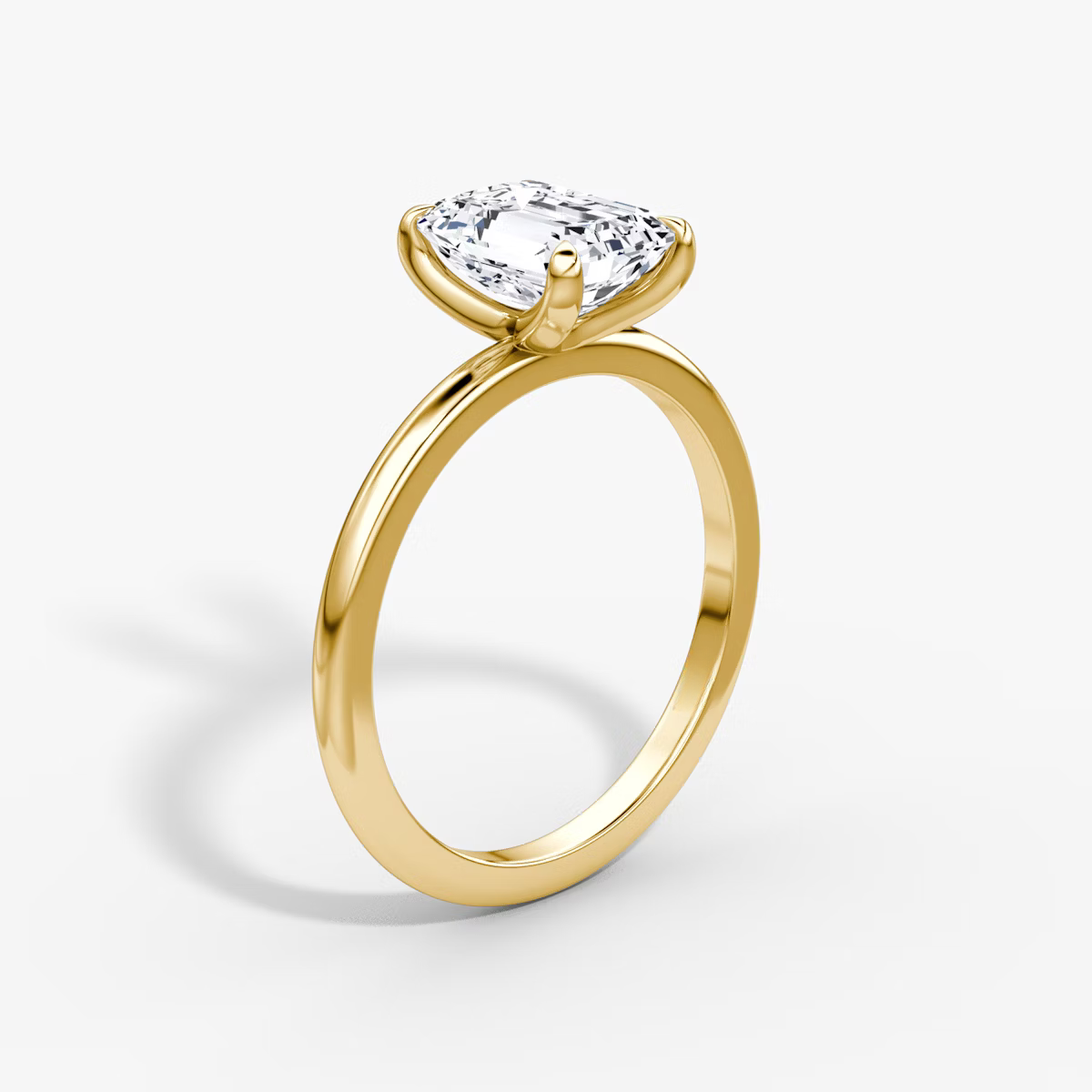 The Classic Emerald Solitaire Diamond Ring