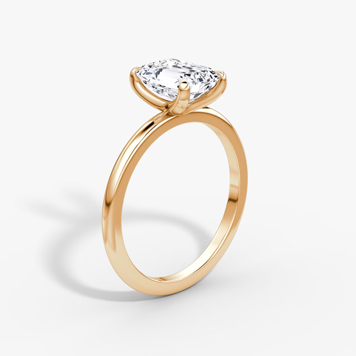 The Classic Emerald Solitaire Diamond Ring