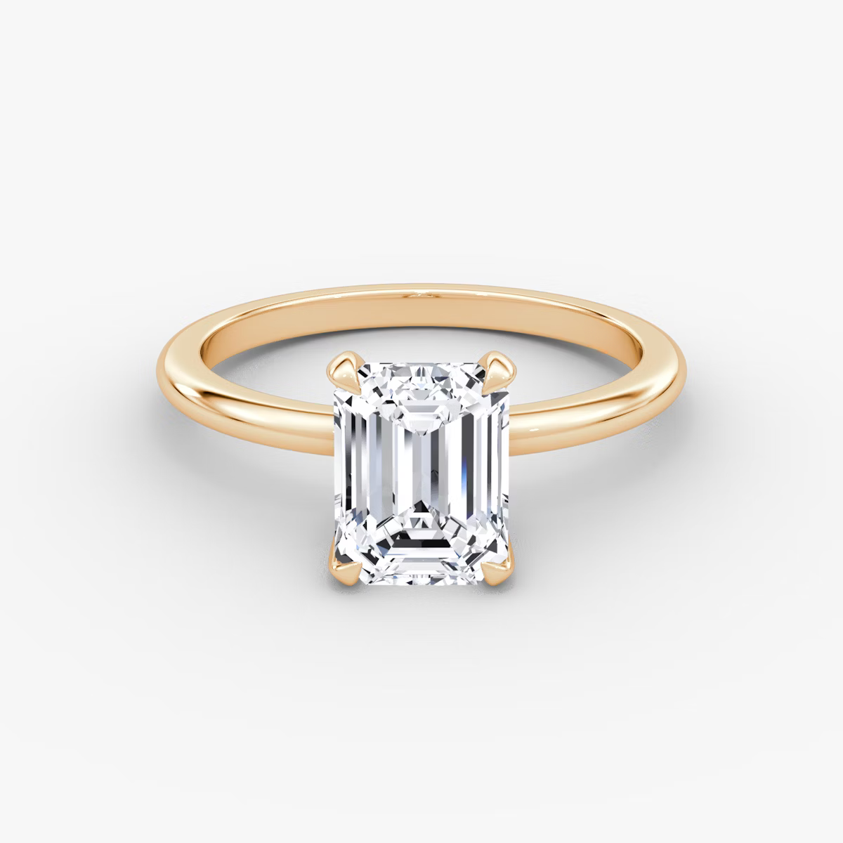 The Classic Emerald Solitaire Diamond Ring
