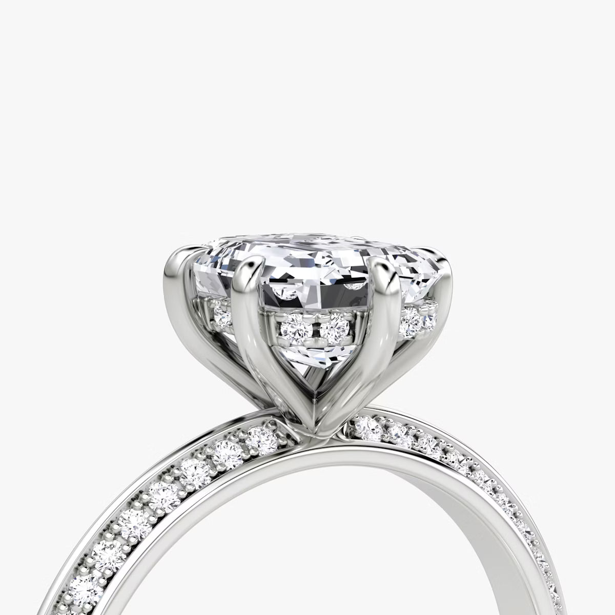 The Sculpted Emerald Hidden Halo Diamond Ring with Pavé Setting
