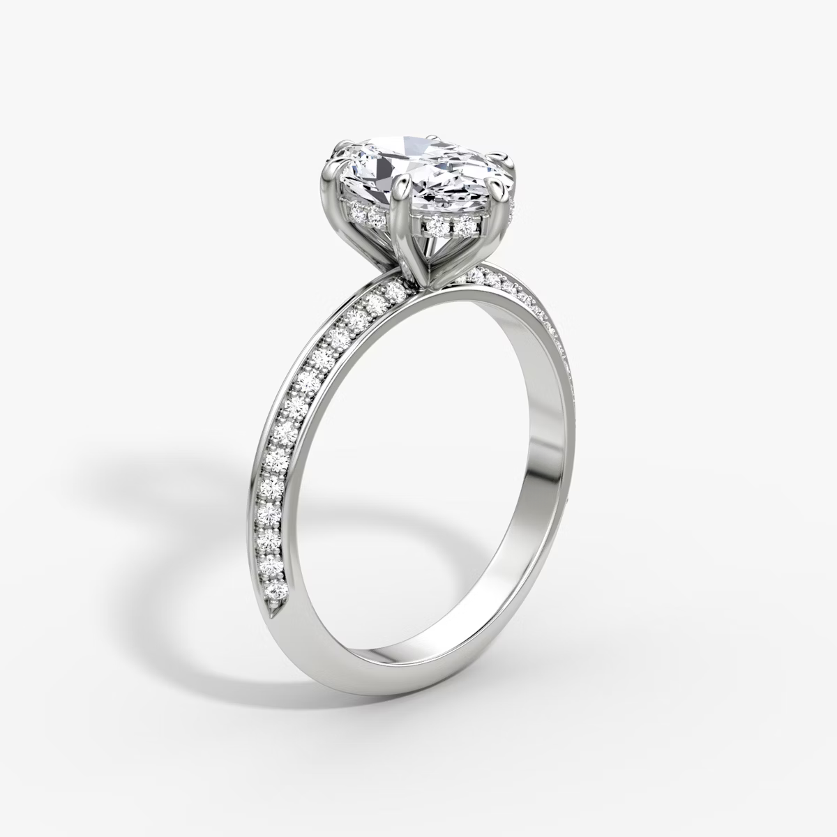The Sculpted Oval Hidden Halo Diamond Ring with Pavé Setting