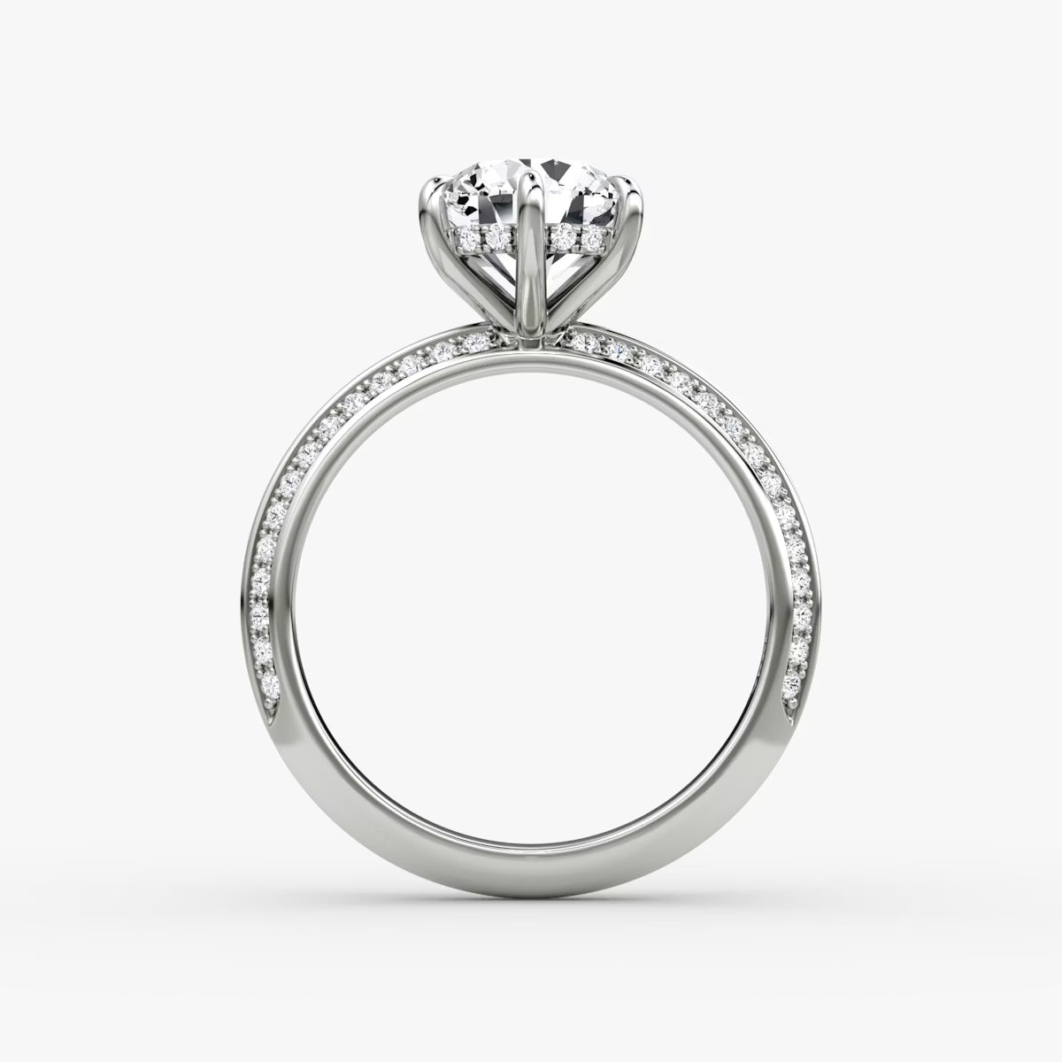 The Sculpted Emerald Hidden Halo Diamond Ring with Pavé Setting